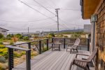 The rooftop patio features a picnic table to enjoy meals while taking in views.